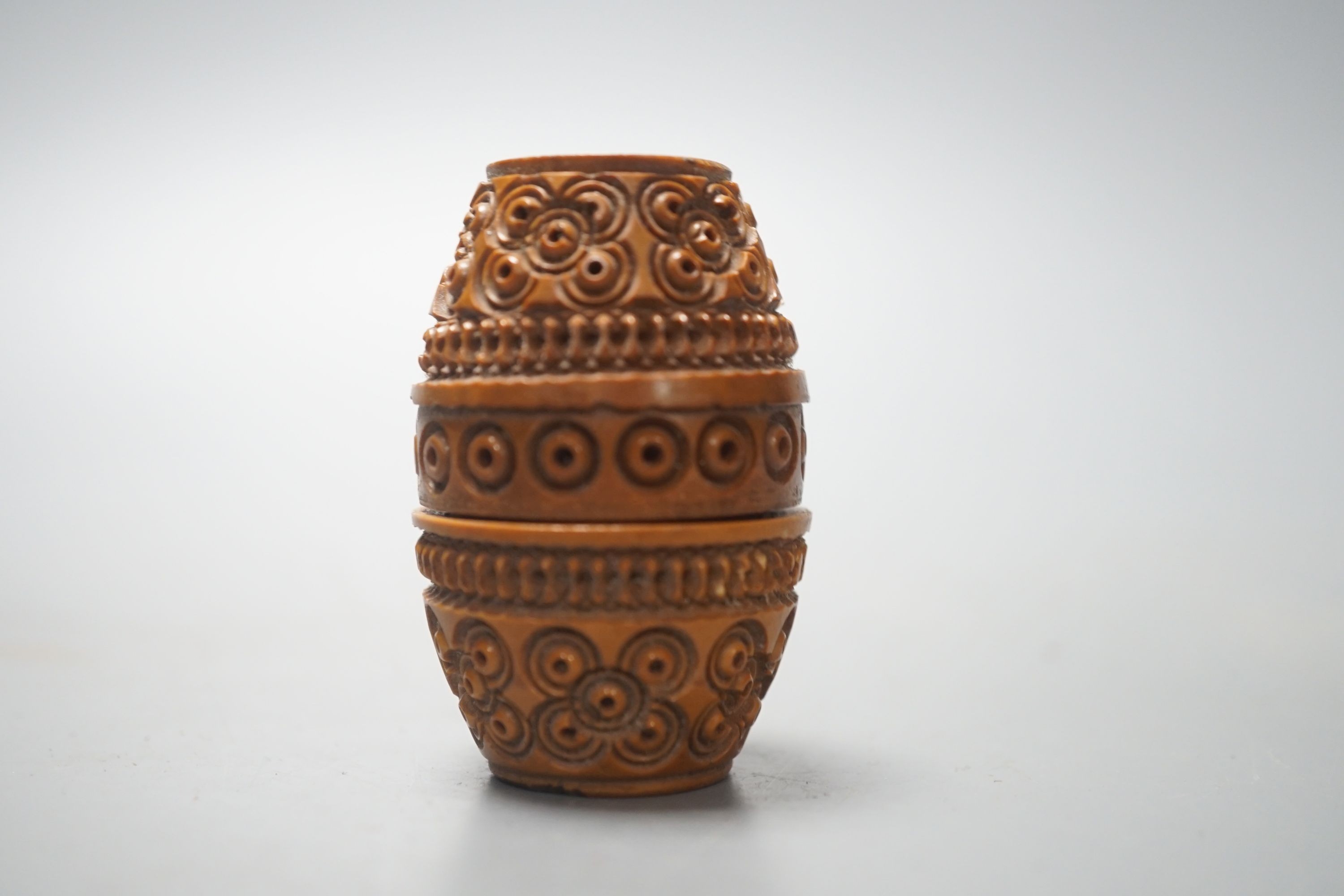 A carved coquilla nut box, 6cms high